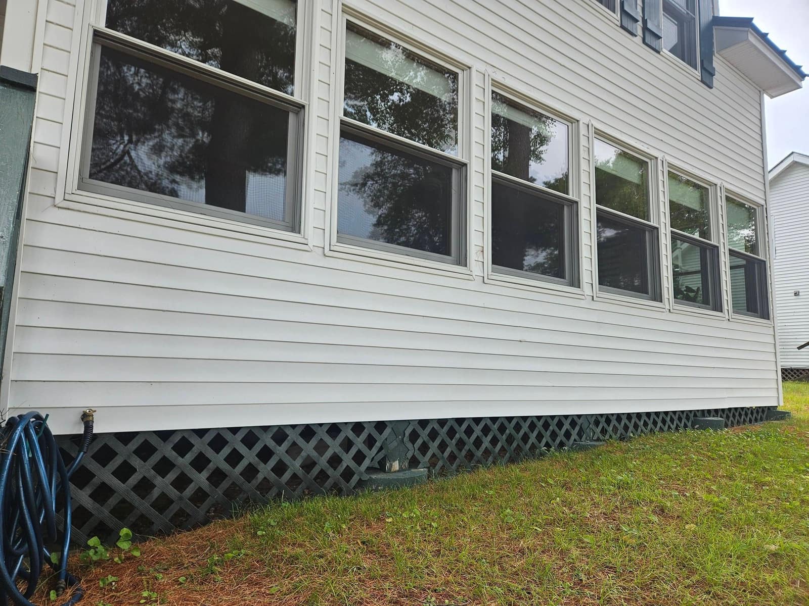 Broken lattice to pine skirting — before